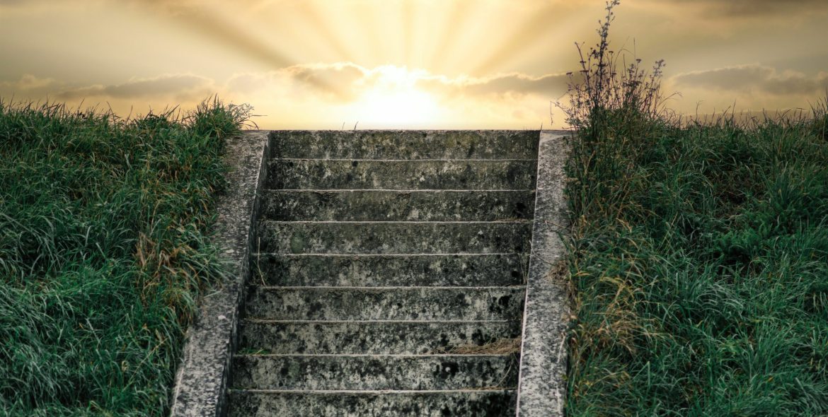 A picturesque outdoor scene depicting a stairway leading towards the sun